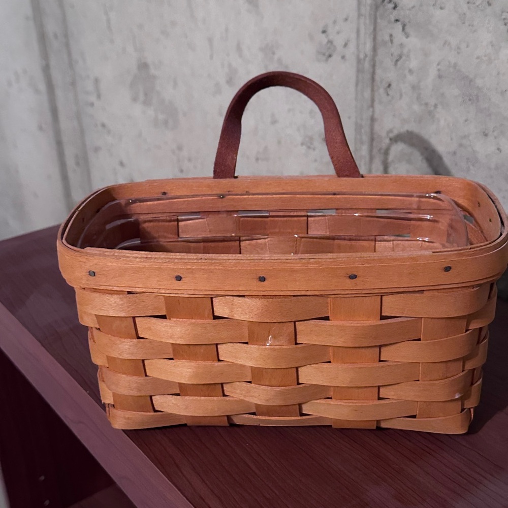 Longaberger storage basket. Can hang on the wall or sit on a table/shelf.